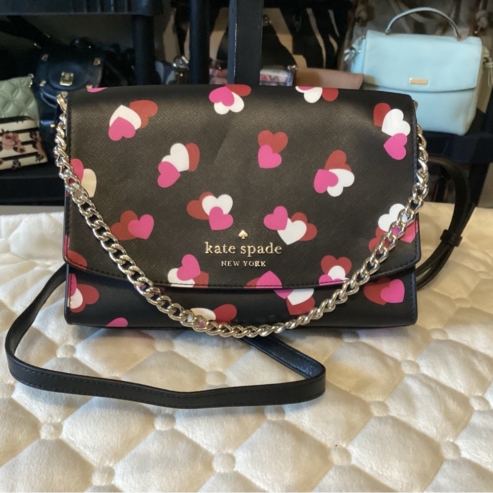 Kate spade black leather crossbody with a silver chain handle and long strap